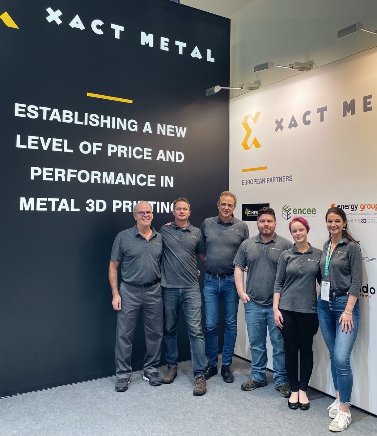 Xact Metal, metal 3d printer manufacturer takes group photo at Formnext, the largest additive manufacturing conference in the world.